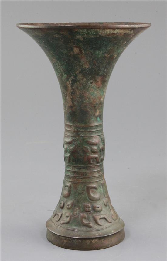 A Chinese archaic bronze ritual wine vessel, Gu, late Shang dynasty, 12th-11th century B.C., probably Anyang, 21.5cm high